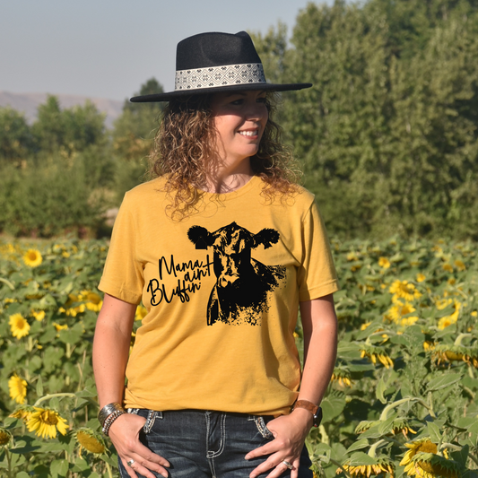 woman wearing t-shirt that says mama ain't bluffin with a picture of a cow. 