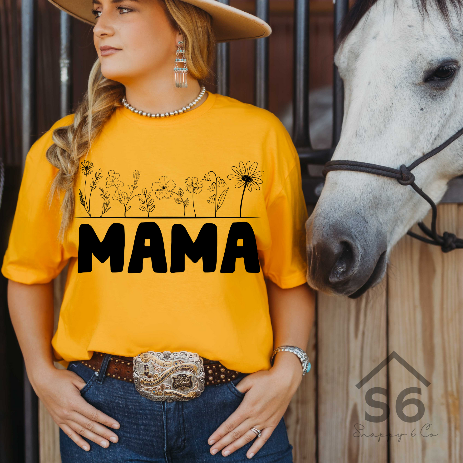 Woman wearing a t-shirt that says MAMA